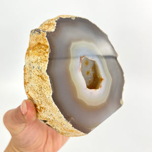 Large Crystals NZ: Large agate polished crystal cave with cut base